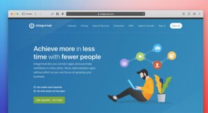 An illustration showing a blue laptop screen with text that reads "Achieve more in less time with fewer people," surrounded by stylized floating icons of people, gears, and communication bubbles. The image represents the efficiency and organizational benefits of professional WordPress website maintenance.