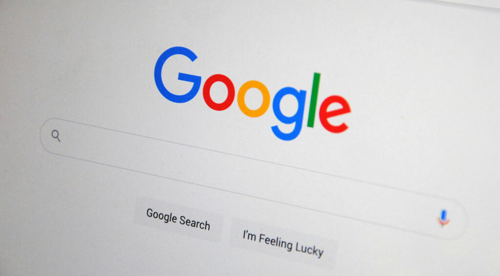 A clean, minimalist view of the Google search homepage, featuring the colorful "Google" logo, the search bar, and the "Google Search" and "I'm Feeling Lucky" buttons. This image illustrates the starting point for local search visibility and digital discovery.